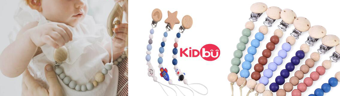 Baby using KIDBU pacifier clip on clothing