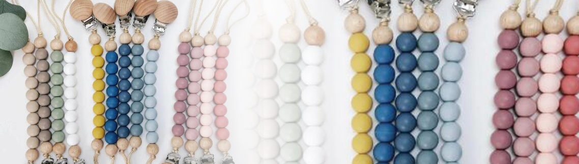 Close-up of KIDBU pacifier clip beads