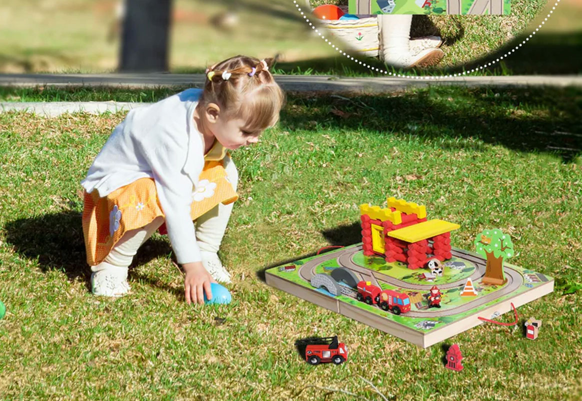 Child building wooden train track